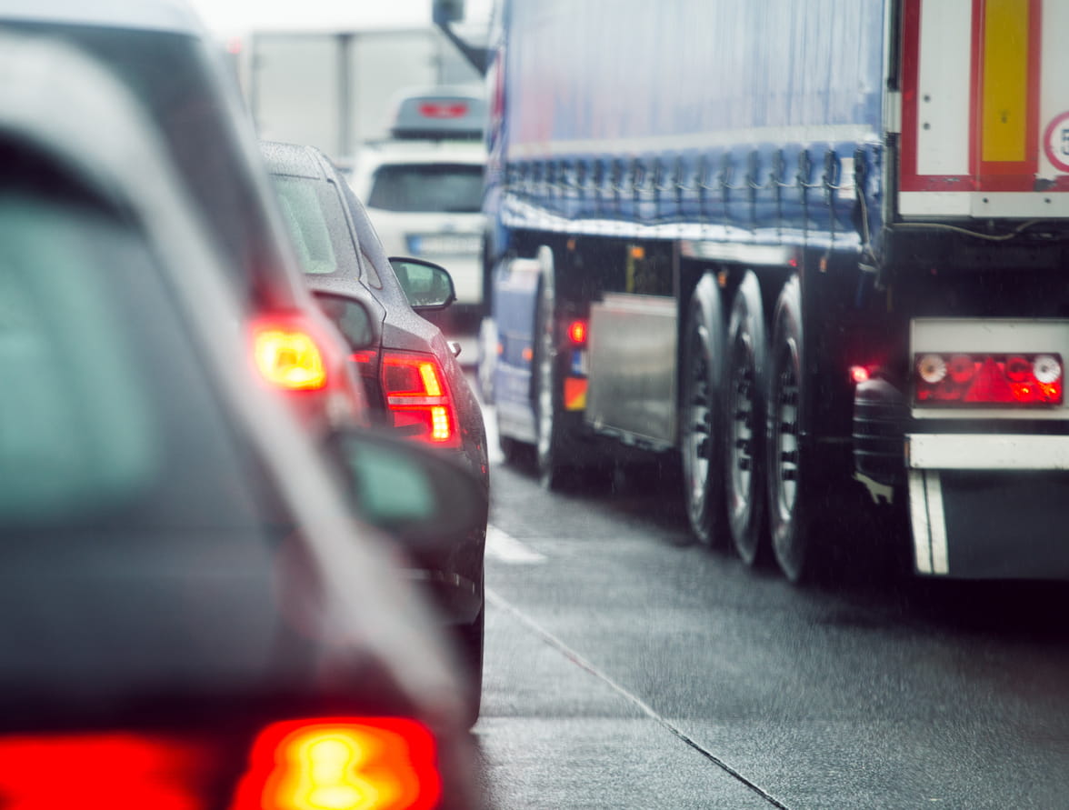 Trucks and cars navigate traffic