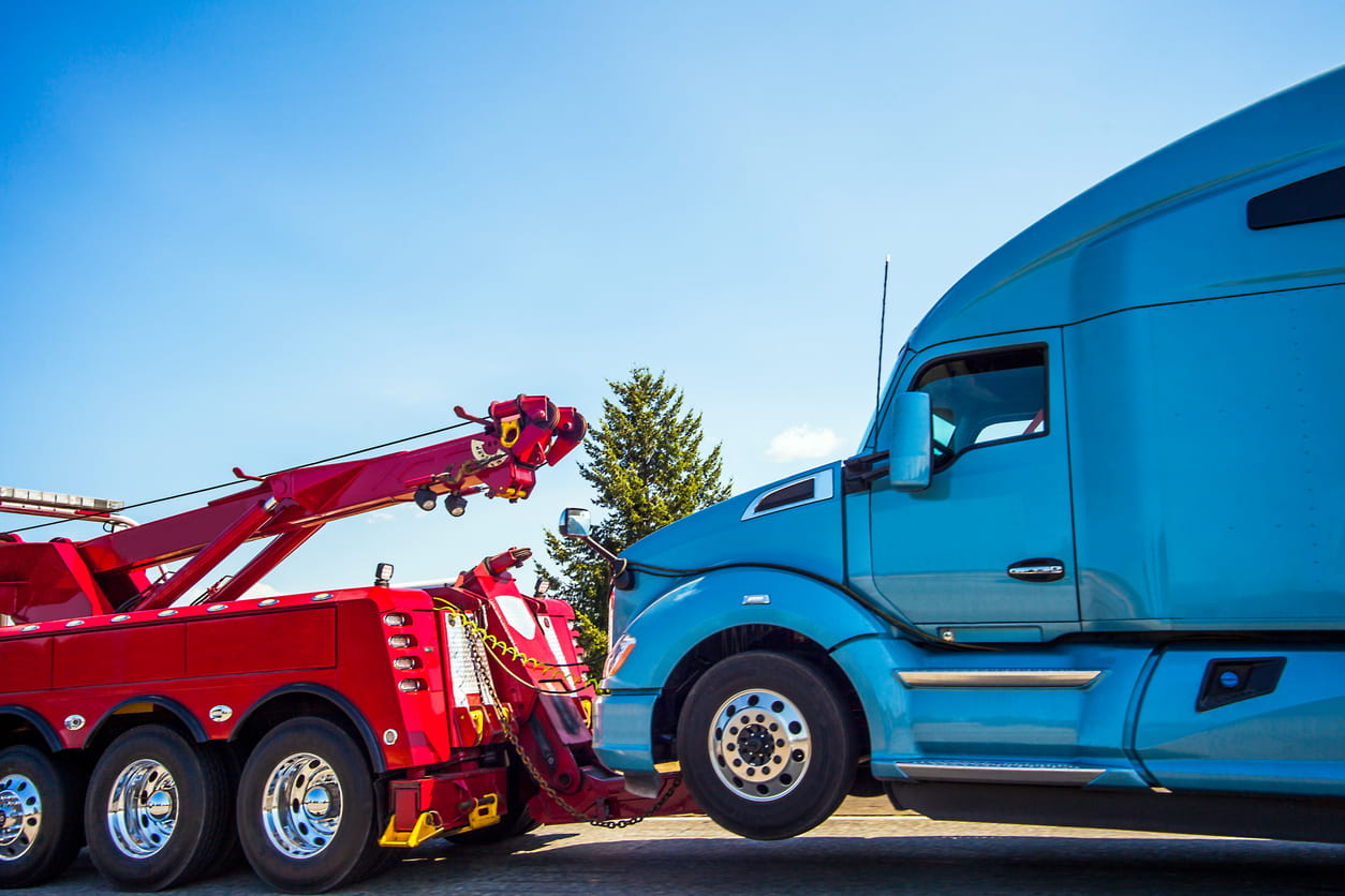 Truck driver's semi is towed away after an accident